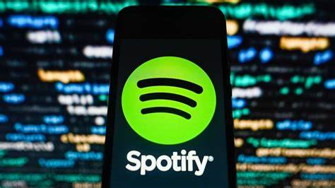 Spotify-Logo auf Smartphone – Symbolbild für Tricks und Lücken im Streaming-System.